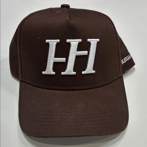 Huega house trucker hat in brown.